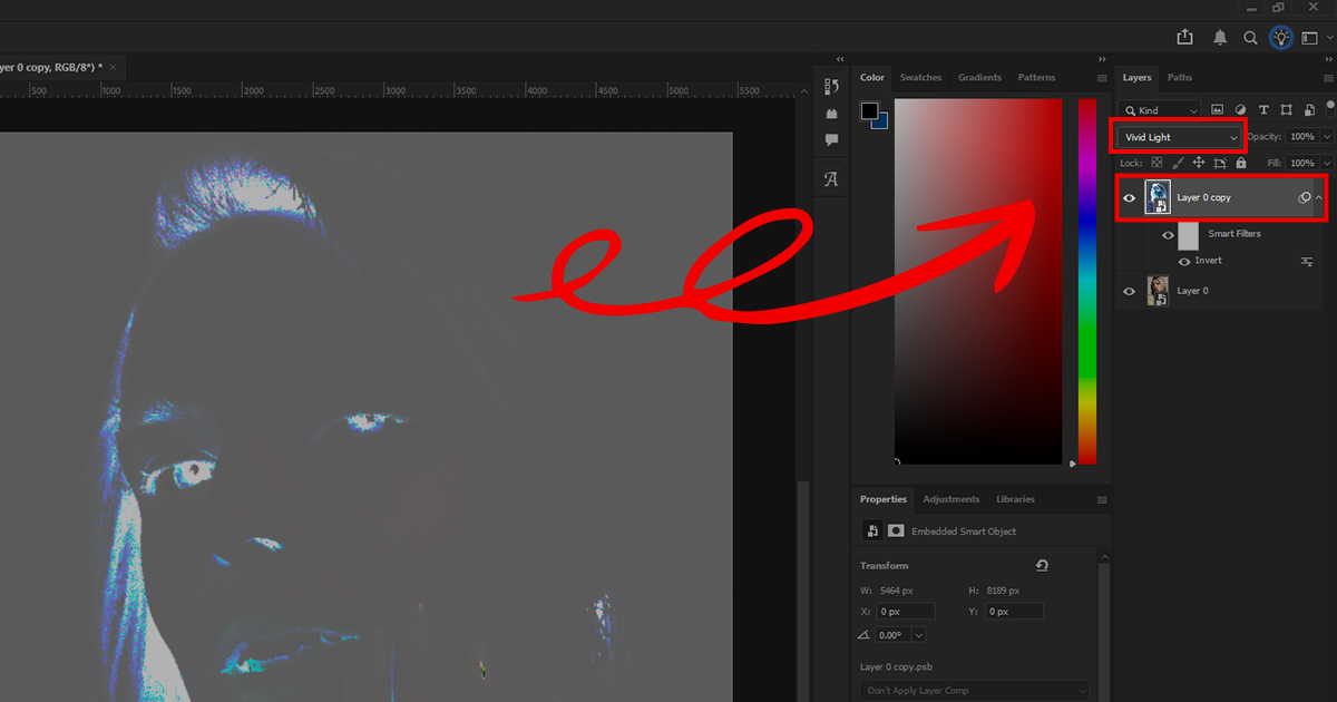 Photoshop window showing an inverted portrait layer set to Vivid Light blend mode with a red arrow highlighting the selected layer